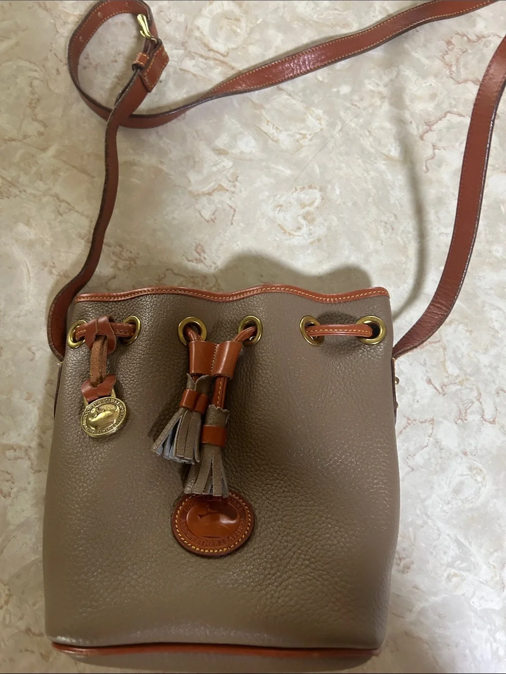 Dooney & Bourke Taupe Leather Crossbody Bucket Bag with Brown Trim